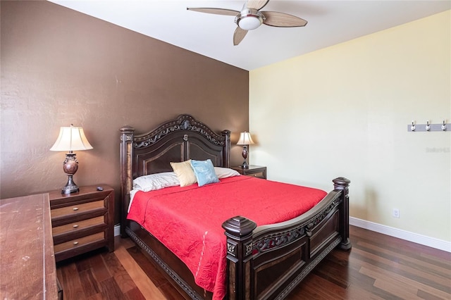 bedroom with ceiling fan and dark hardwood / wood-style flooring