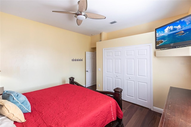 bedroom featuring dark hardwood / wood-style flooring, a closet, and ceiling fan