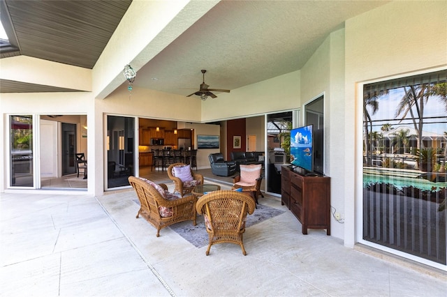 view of patio featuring ceiling fan