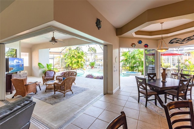 interior space featuring a tray ceiling and ceiling fan