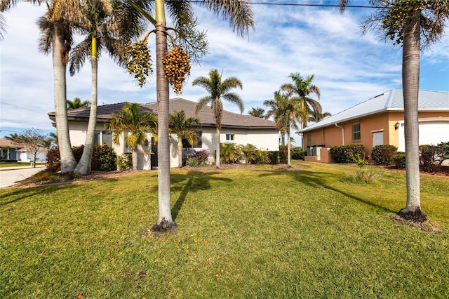 ranch-style home featuring a front yard