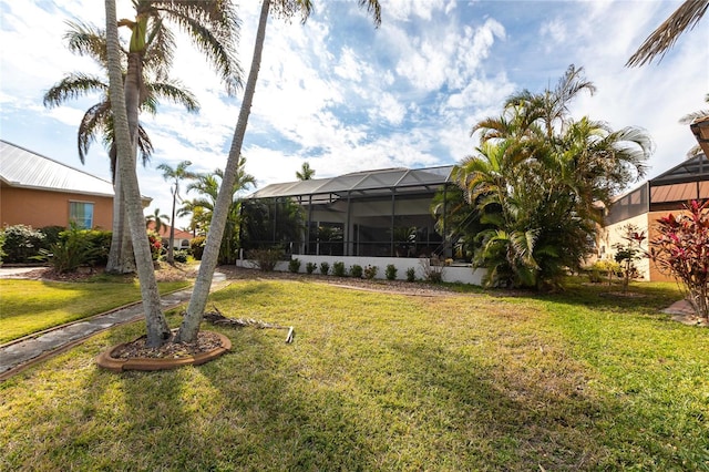 view of yard with a lanai