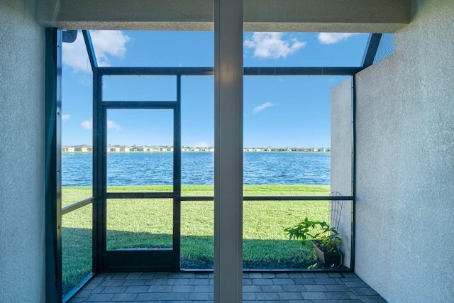 interior space featuring a healthy amount of sunlight and a water view