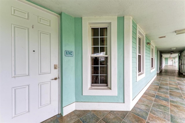 entrance to property featuring a porch