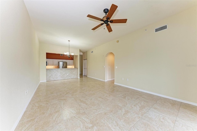 unfurnished living room with ceiling fan with notable chandelier