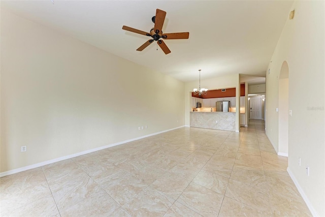 unfurnished living room featuring ceiling fan with notable chandelier