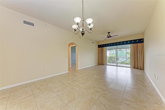 spare room featuring ceiling fan with notable chandelier