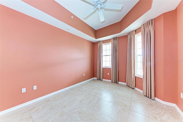 spare room with ceiling fan