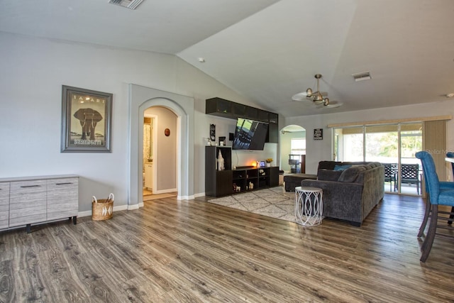 living room with hardwood / wood-style floors and vaulted ceiling