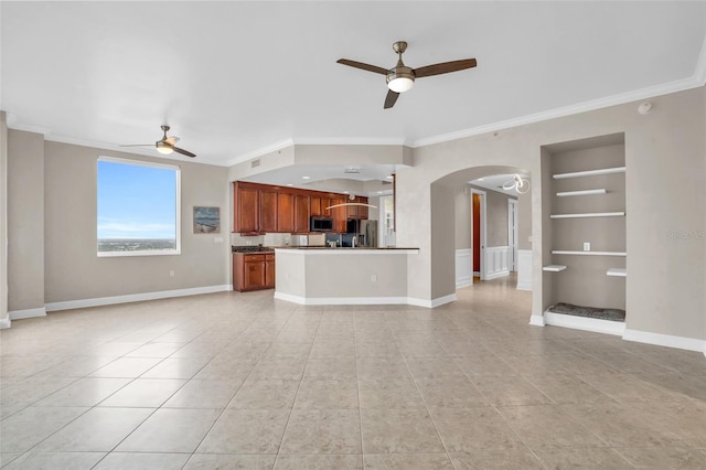 unfurnished living room featuring ceiling fan, built in features, light tile patterned flooring, and ornamental molding