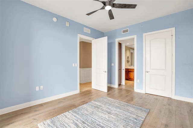 unfurnished bedroom with ceiling fan and light hardwood / wood-style flooring