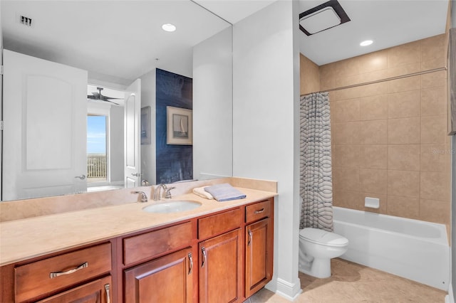 full bathroom featuring vanity, tile patterned floors, ceiling fan, toilet, and shower / bath combo with shower curtain