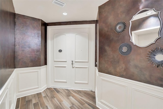 doorway to outside with light hardwood / wood-style floors