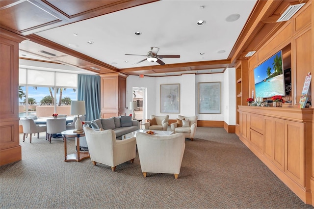 living room featuring carpet, built in shelves, ceiling fan, and crown molding