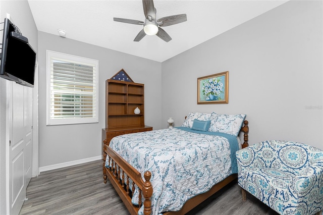 bedroom featuring hardwood / wood-style floors and ceiling fan