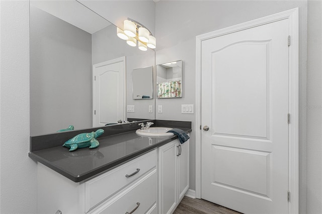 bathroom with vanity and hardwood / wood-style floors