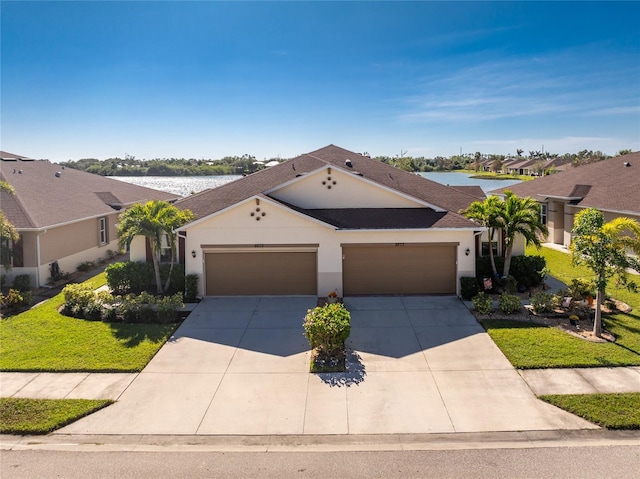 ranch-style home with a garage and a front lawn