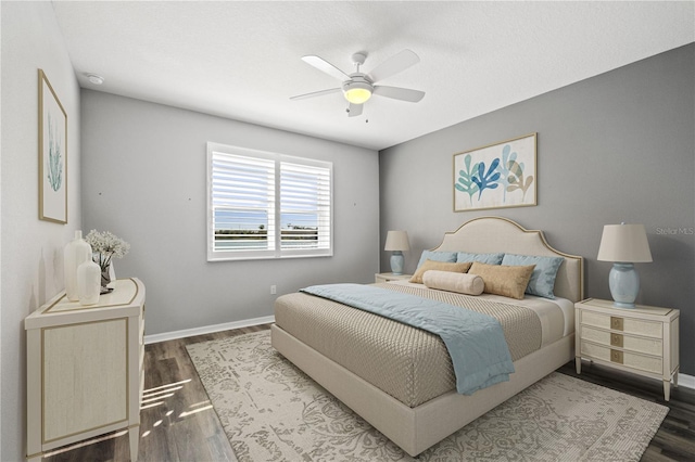 bedroom featuring dark wood-type flooring and ceiling fan