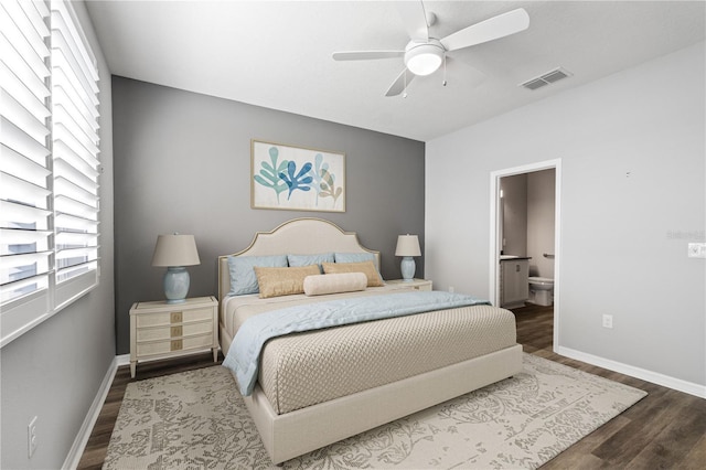 bedroom featuring hardwood / wood-style flooring, ensuite bath, and ceiling fan