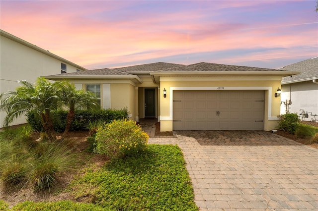 view of front of property with a garage