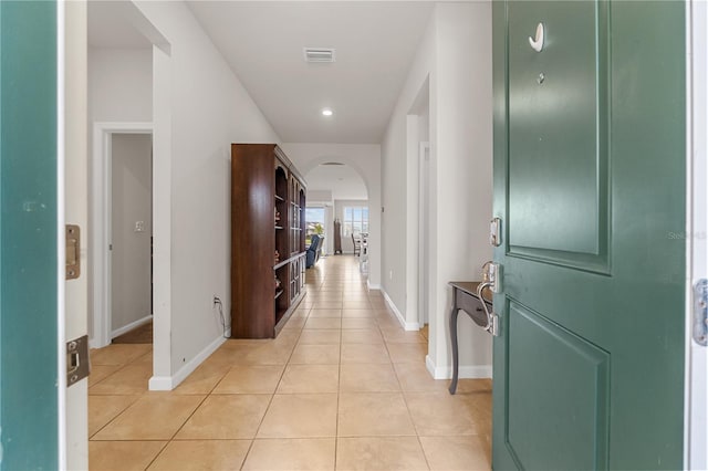 hallway with light tile patterned floors