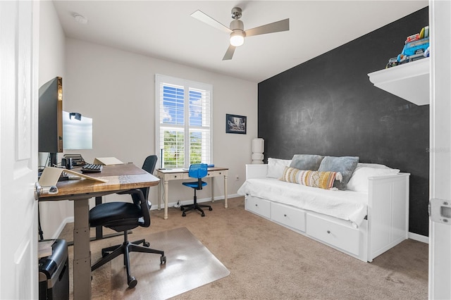 carpeted office featuring ceiling fan