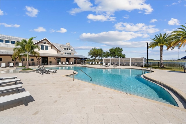 view of swimming pool with a patio area