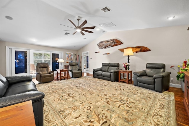 living room featuring lofted ceiling, dark wood-type flooring, and ceiling fan