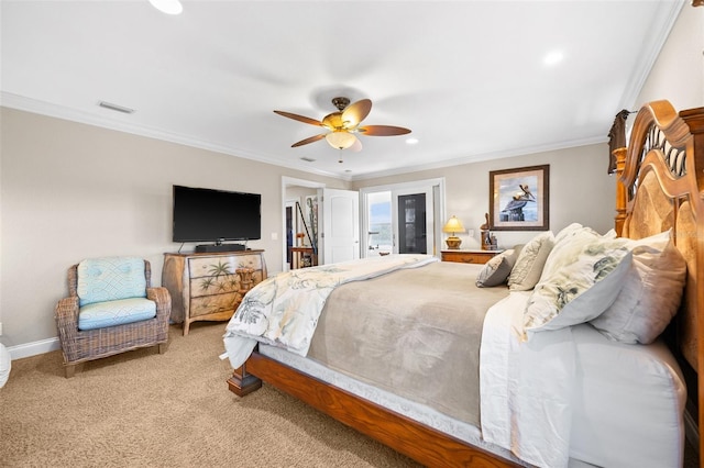 carpeted bedroom featuring ornamental molding and ceiling fan