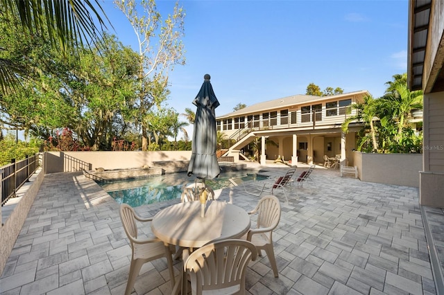 view of patio / terrace featuring a swimming pool