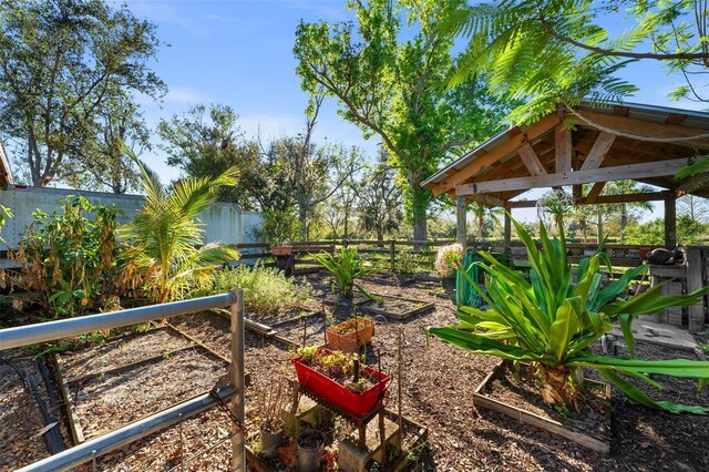 8625 SW County Road 769, Arcadia, FL 34269 - fenced backyard featuring a garden