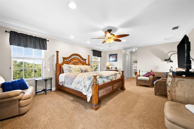 bedroom featuring crown molding and light colored carpet