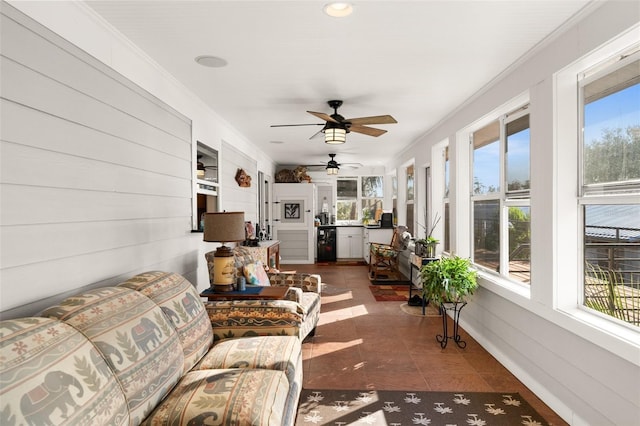 sunroom / solarium with beverage cooler and ceiling fan