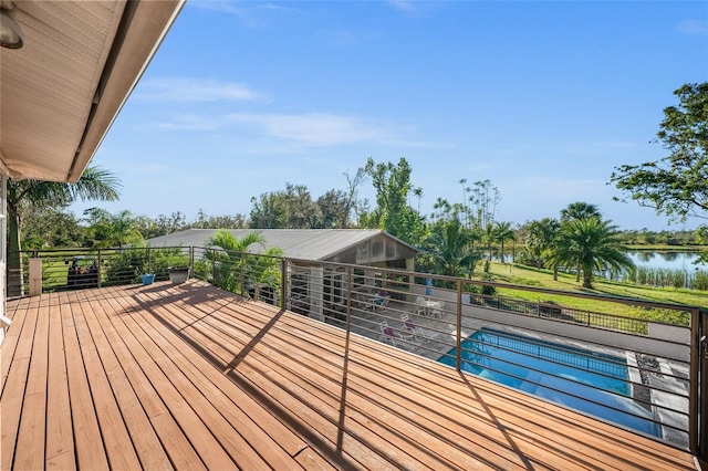 wooden deck featuring a water view