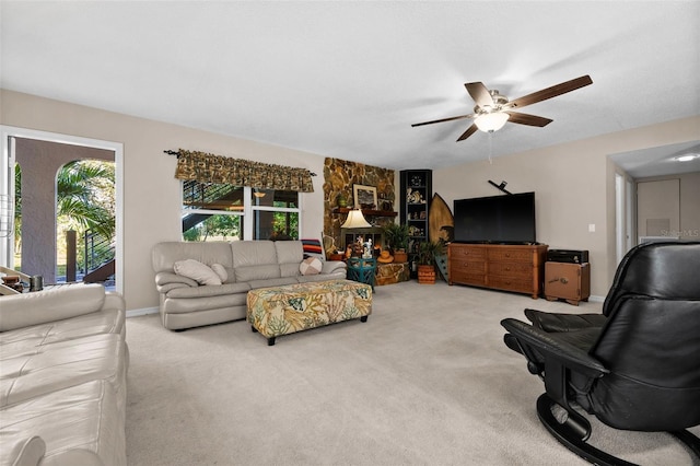 living room featuring ceiling fan and carpet floors