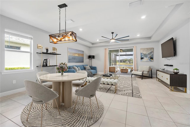 tiled dining room featuring ceiling fan and a wealth of natural light