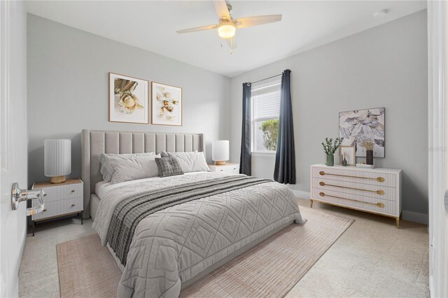 carpeted bedroom with ceiling fan