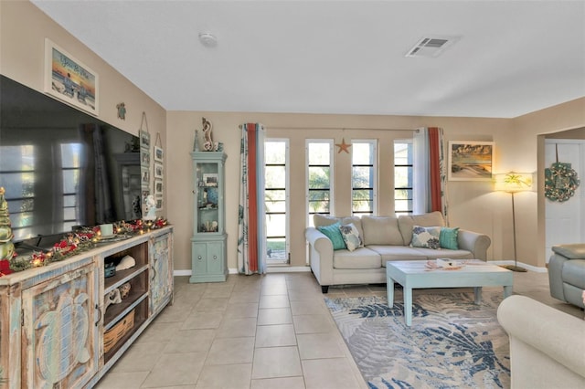 living room with light tile patterned flooring