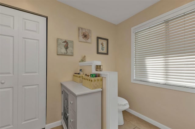 bathroom featuring tile patterned floors and toilet