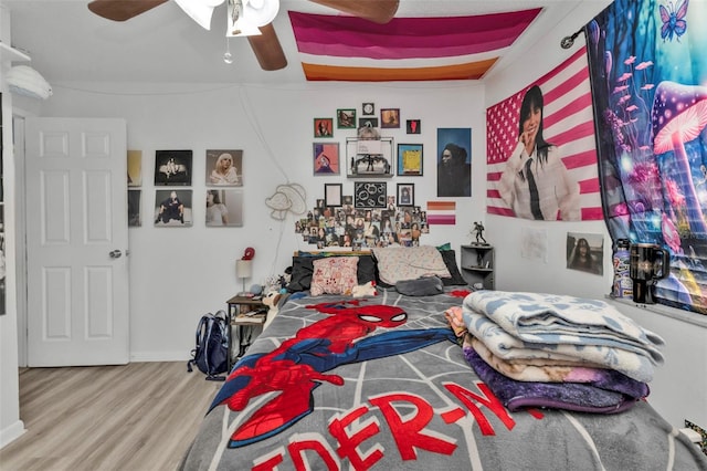 bedroom featuring hardwood / wood-style floors and ceiling fan