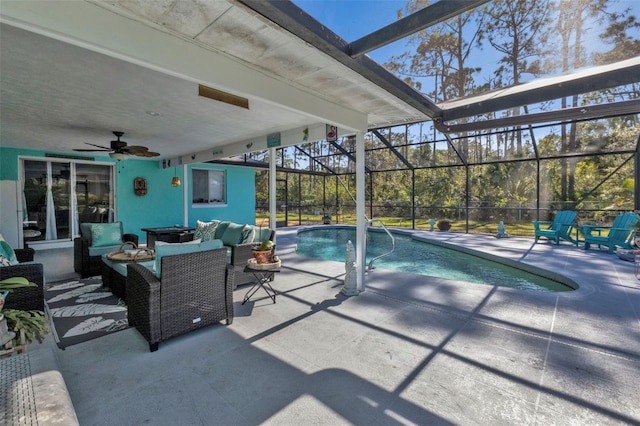 view of pool featuring outdoor lounge area, ceiling fan, a patio area, and glass enclosure