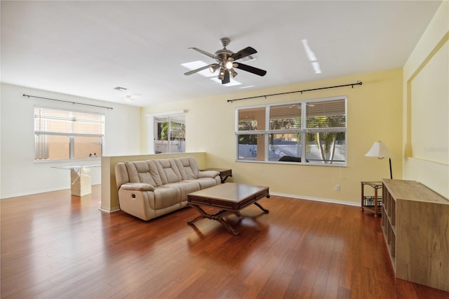 living room featuring hardwood / wood-style flooring and ceiling fan