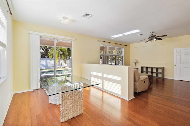 dining room with light hardwood / wood-style floors, ceiling fan, and a healthy amount of sunlight