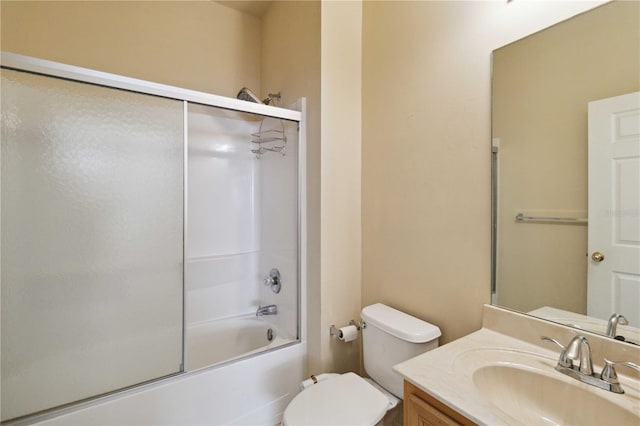 full bathroom with vanity, toilet, and shower / bath combination with glass door