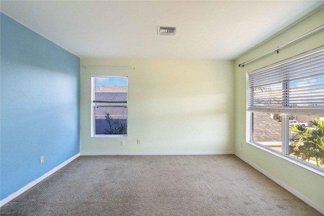 unfurnished room with carpet floors