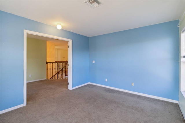 spare room featuring carpet floors