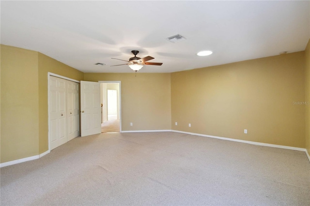 carpeted empty room with ceiling fan