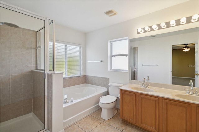 full bathroom featuring tile patterned floors, plenty of natural light, toilet, and vanity