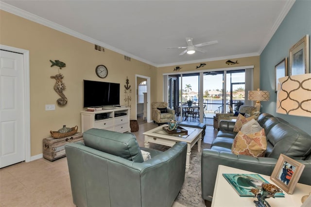 living room with ceiling fan and ornamental molding