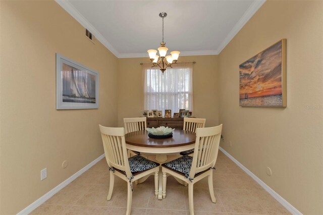 dining space featuring ornamental molding, light tile patterned floors, and an inviting chandelier